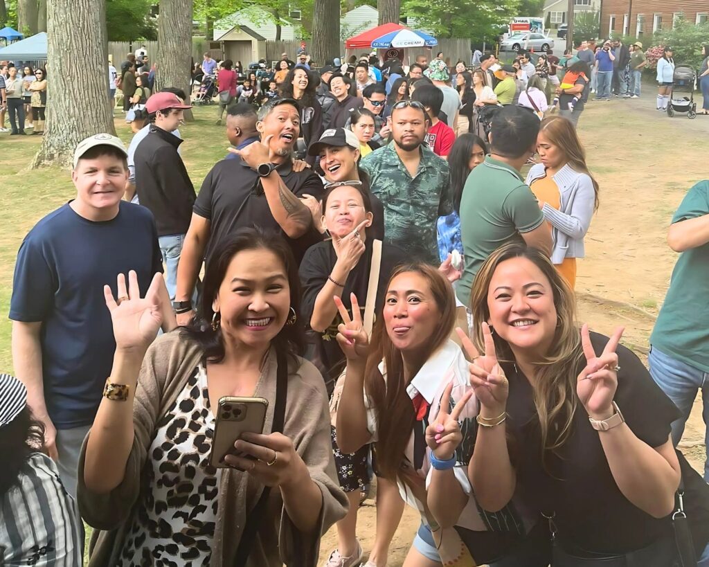 A lively crowd at the first Fil-Am Spring Fest 2023, excitedly lining up for delicious Filipino food.